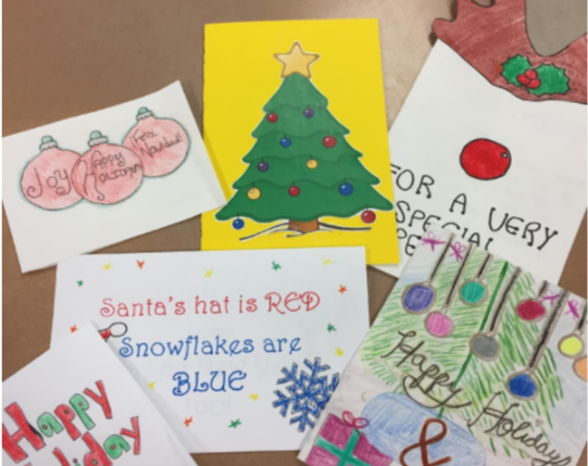 Students in the Red Cross Club made holiday cards for servicemen and women.