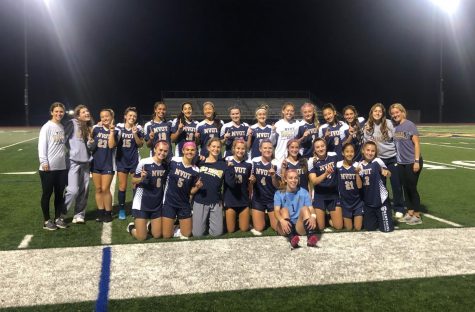 The girls pose for a group picture after winning their league.