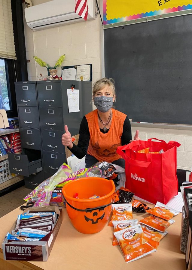Mrs. Nelson preparing her candy and snack spread for the Tot trick-or-treaters.