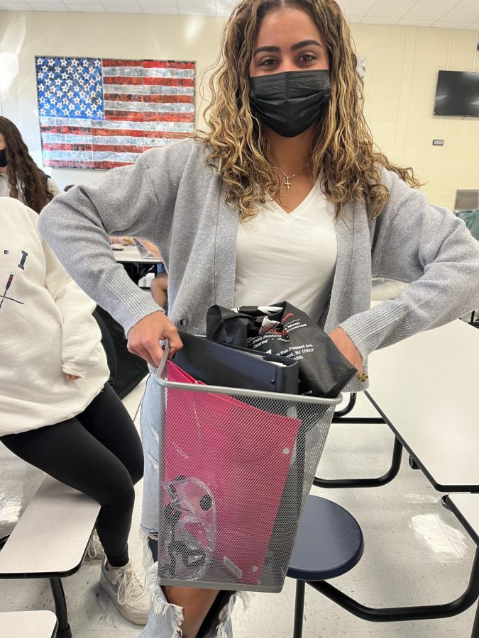 Abby Dennis using a trash bin on Anything But a Backpack Day.