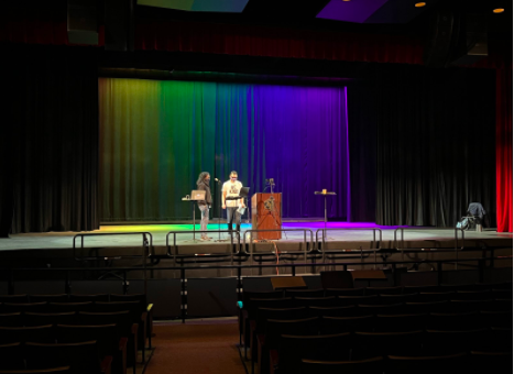 Poetry Out Loud participants get ready to recite their poems to an empty auditorium. 