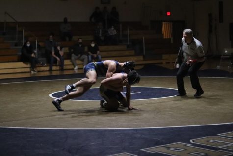 Mercado wrestling his opponent during his match against Teaneck.