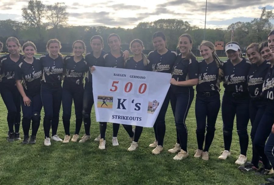 Germano celebrates her 500th strikeout with her teammates post game 