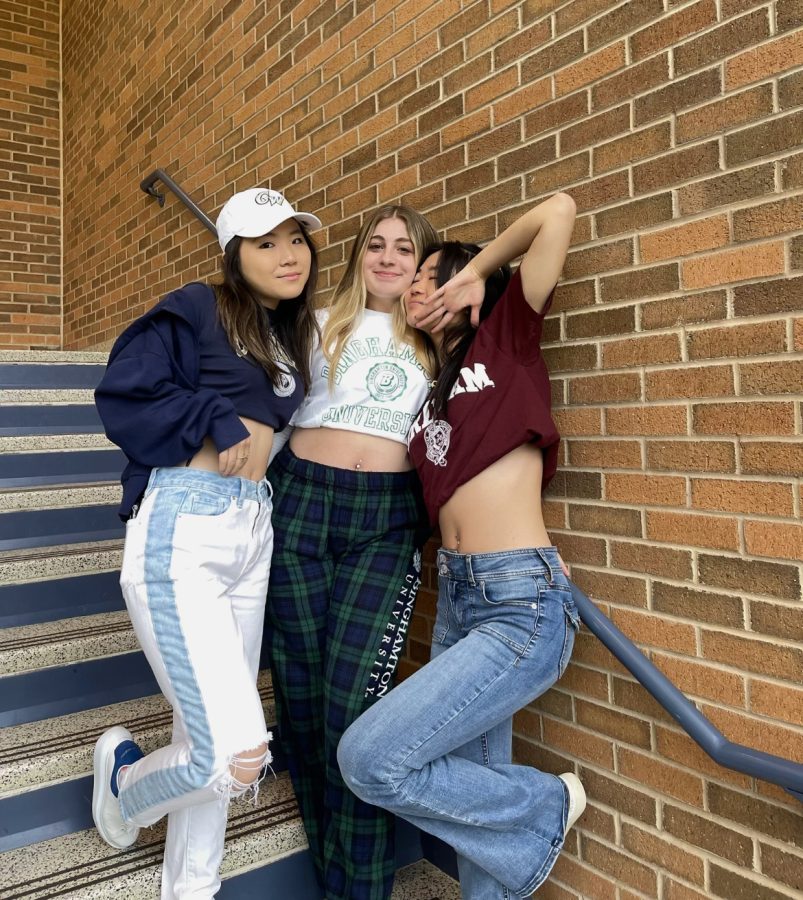Jinsil Yearm, Zoe Cohen, and Erica Ha pose with their college merch.