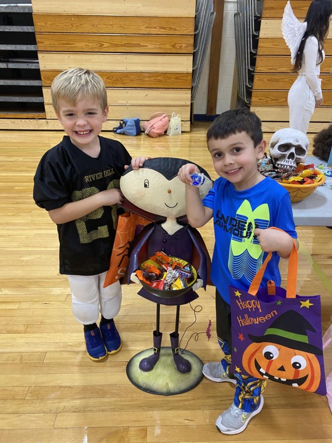 Trunk-or-treaters pose with their treats
