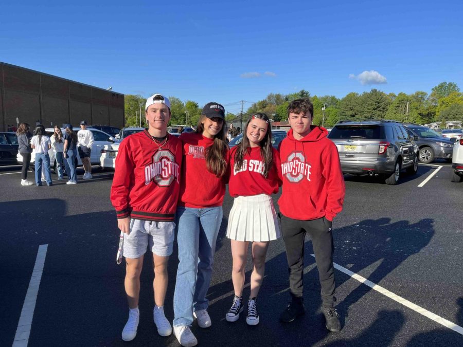 Four seniors off to Ohio State University pose in their red sweatshirts