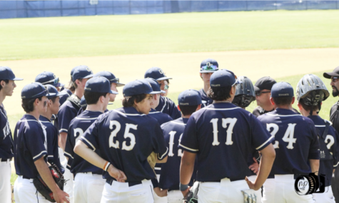 The Varsity Baseball Team in a team huddle during the game against Bergen Catholic in the Semi Finals