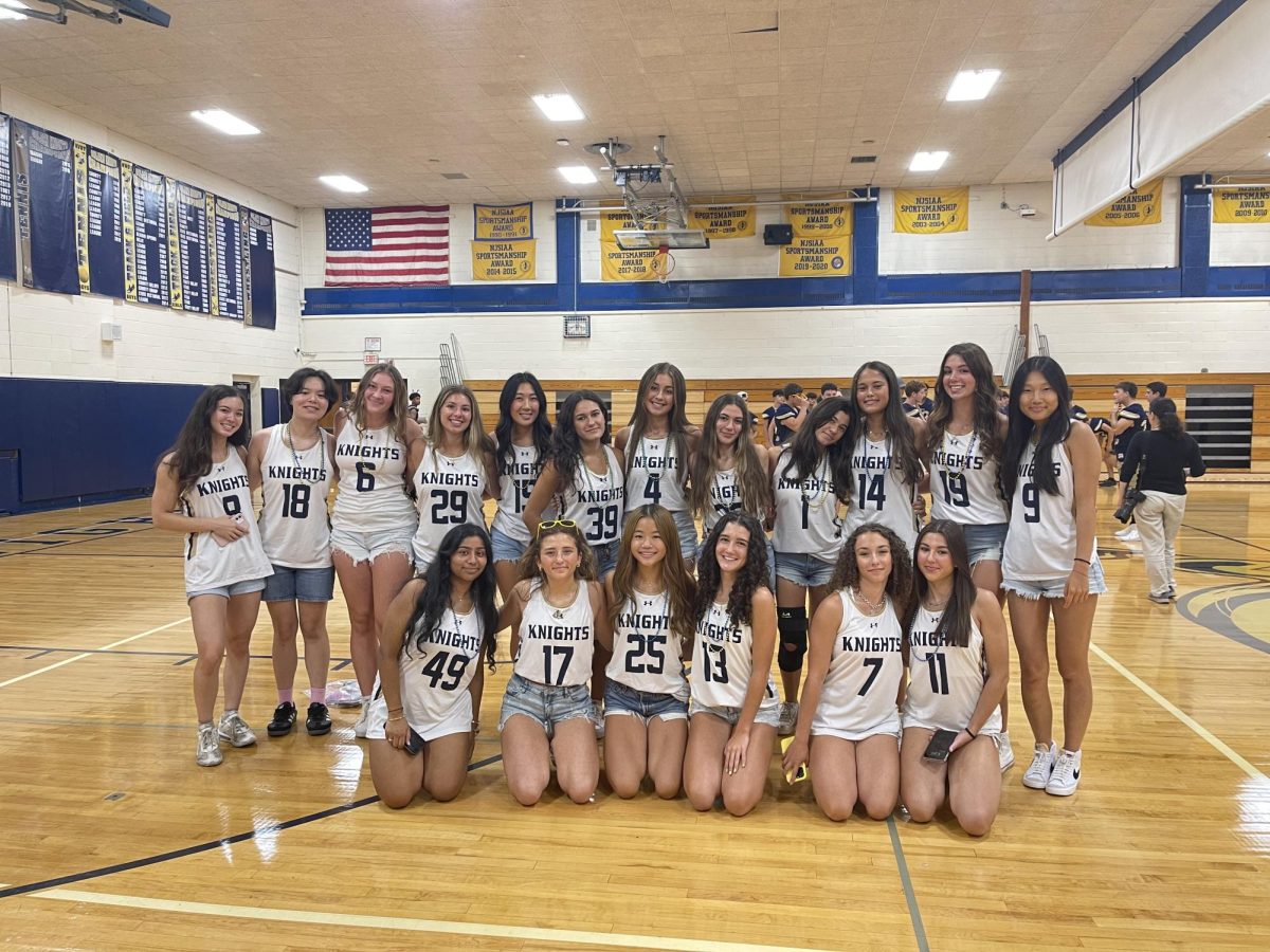 The field hockey team poses for a photo ahead of their pep rally entrance.