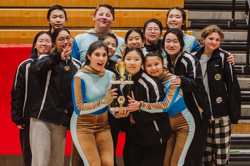 The Northern Valley Winter guard poses with their first place trophy.