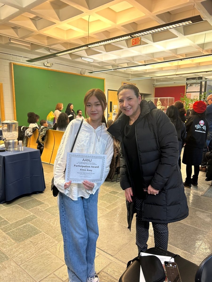 Pictured Left: Kimin Kang and her art teacher Nicole Cole at the January 28 Emerging Artist Art Show and Award Ceremony 