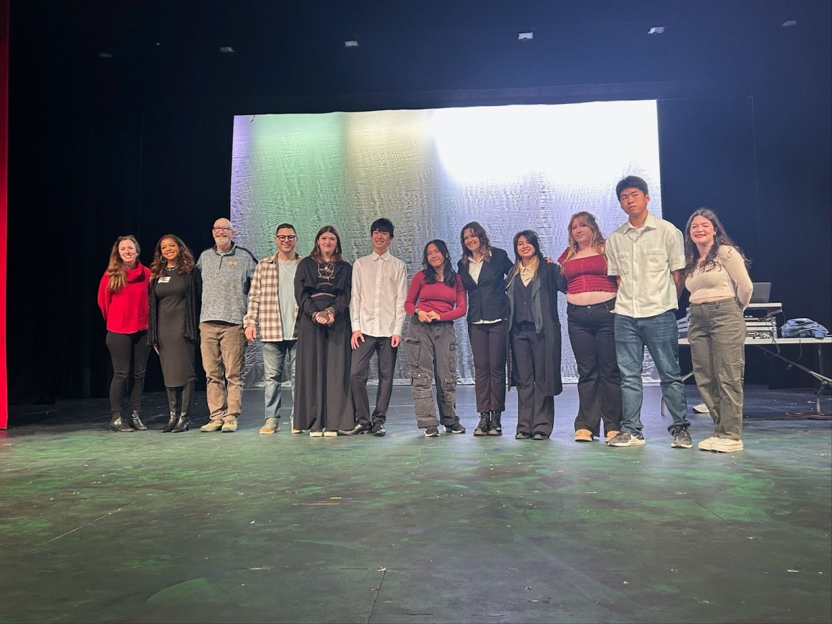 A photo taken of some of the competitors at Poetry Out Loud including the head teacher, Jeffrey Train