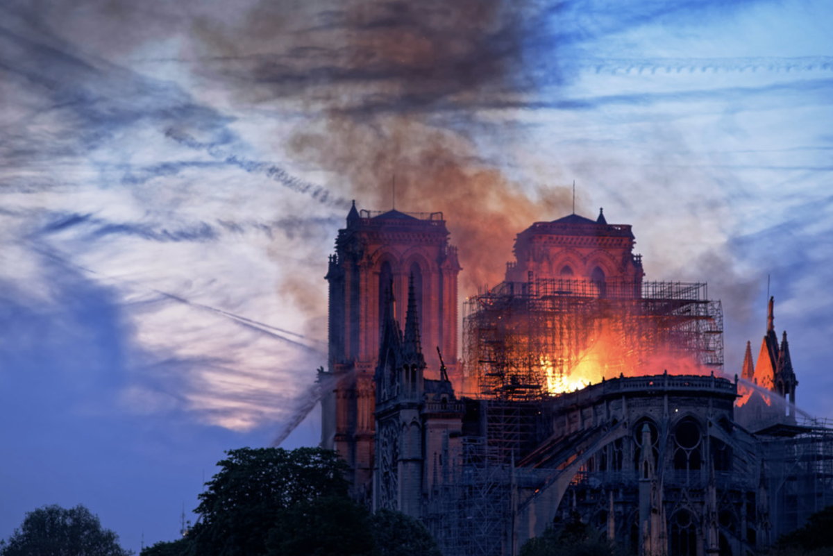 Hoses battle flames as the Notre Dame Cathedral catches fire during Holy Week
