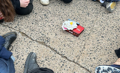 Members of the Magic the Gathering division sit and play Exploding Kittens. Despite the stress of the morning, the division still managed to find a way to make memories.