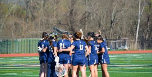 Girls lacrosse team getting ready to compete.