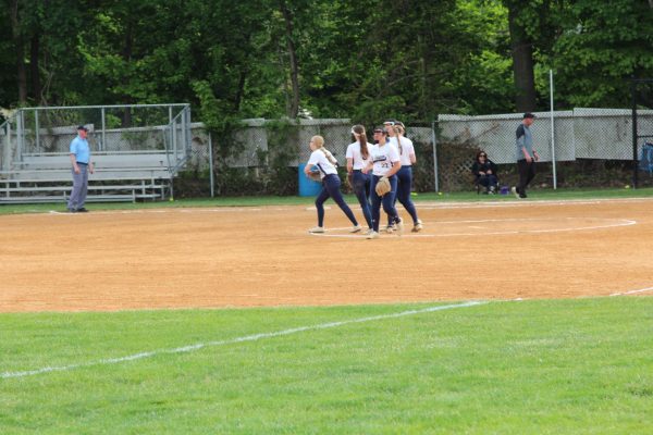 The Latest - Golf Captures Title and Softball Advances