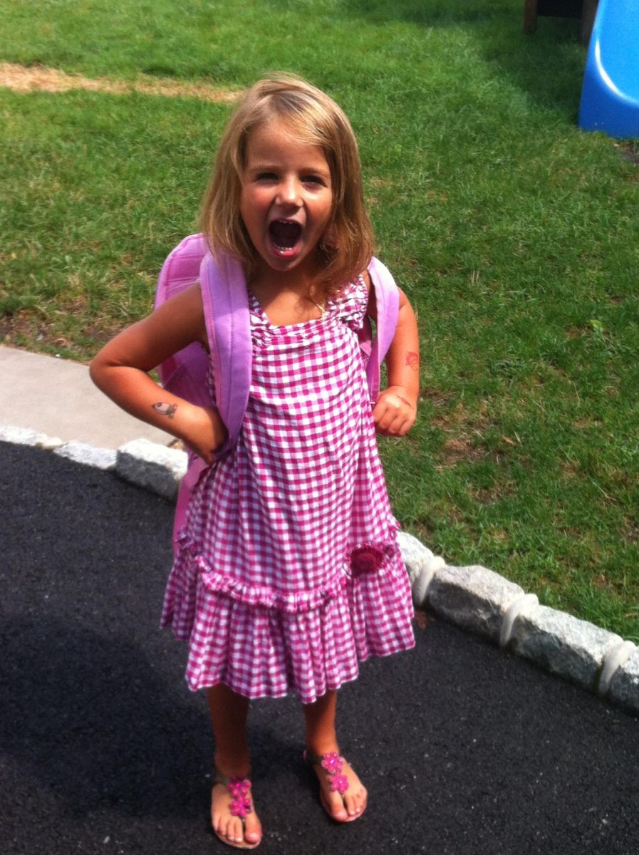 September 5, 2012: Me, hands on my hips and smiling, ready to take on any wave on my first ever day of school.