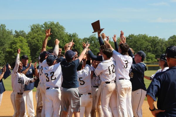 Team celebrate after receiving the plaque.