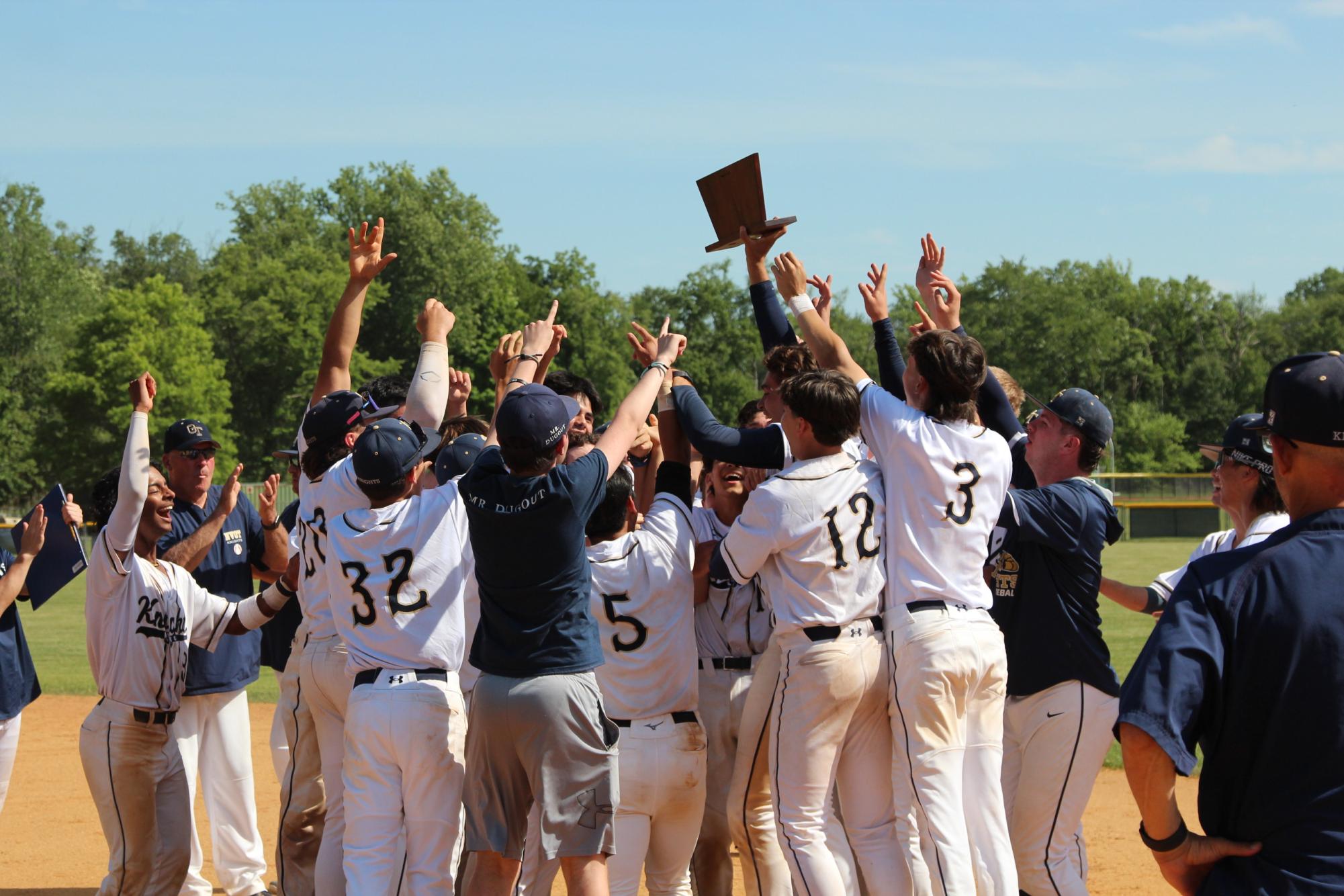 Team celebrate after receiving the plaque.
