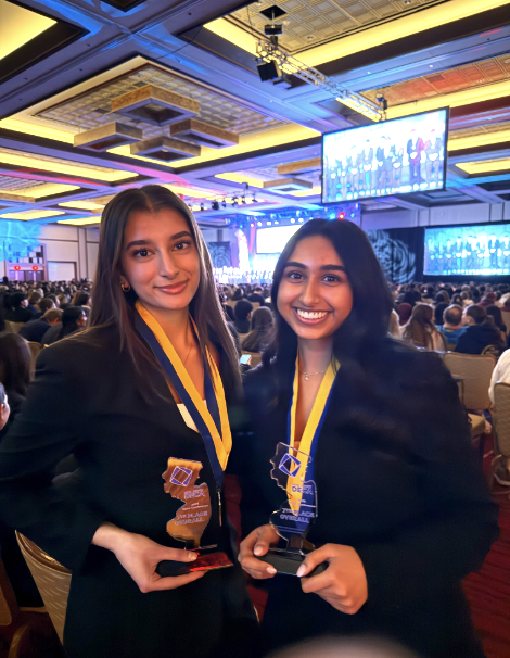 Anoo and Damwani posing at States after qualifying for Nationals 